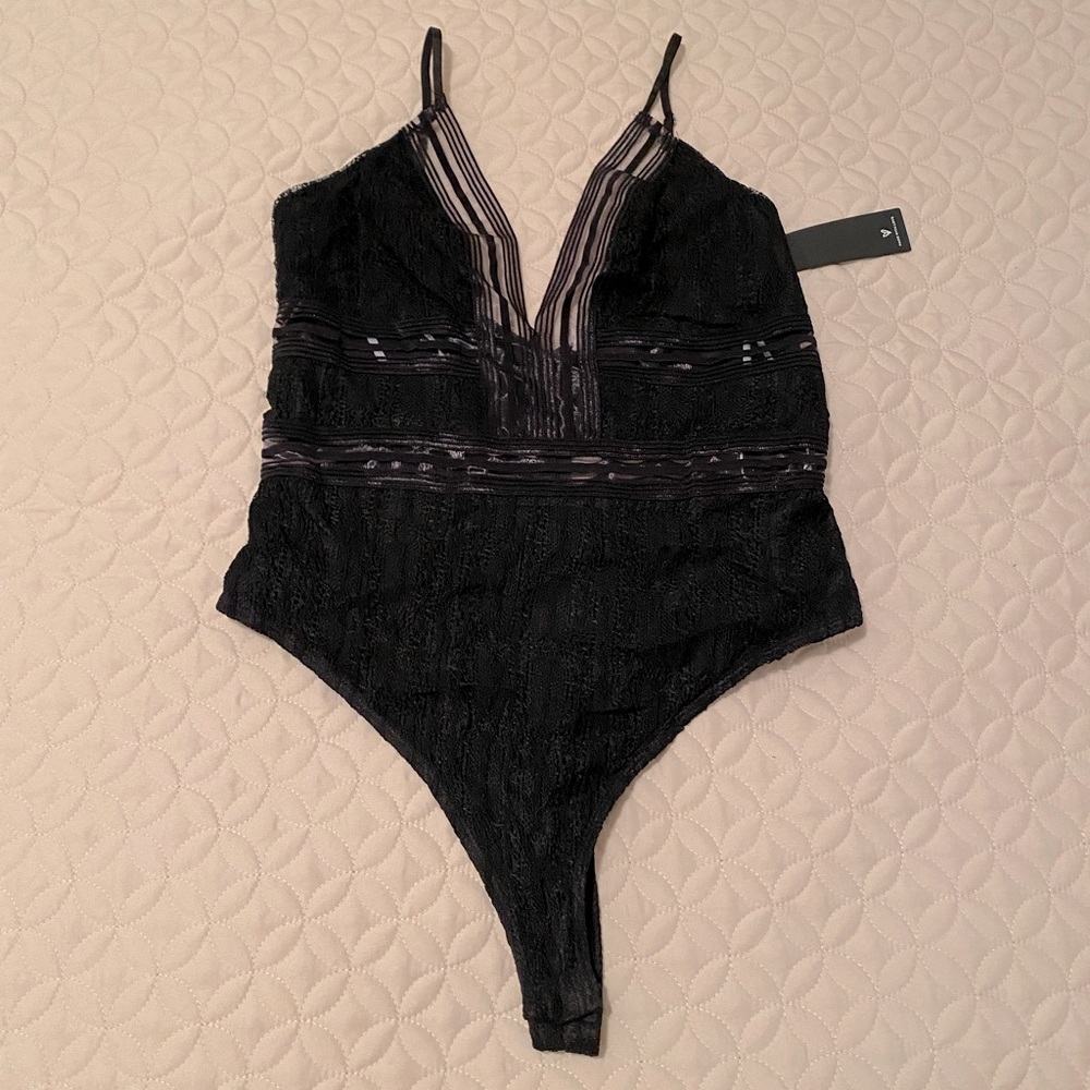 New with tags mesh cut out bodysuit